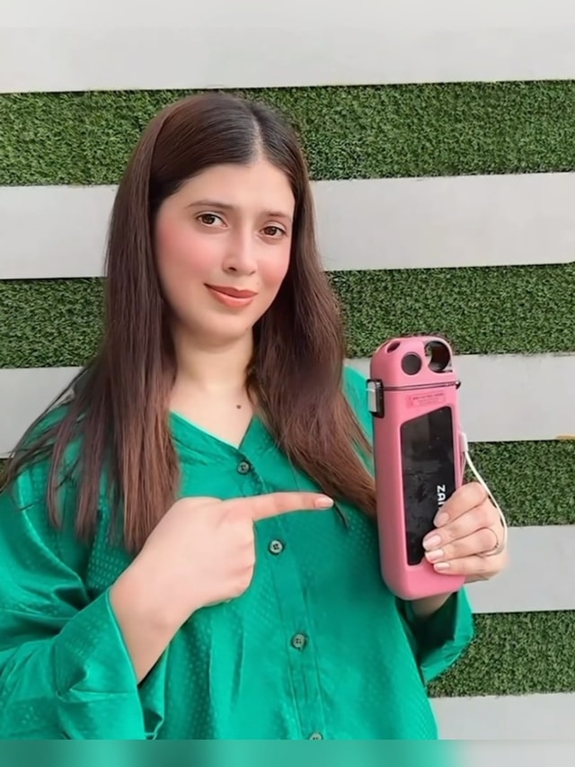 Customer with Zanuo bottle, portrait 2
